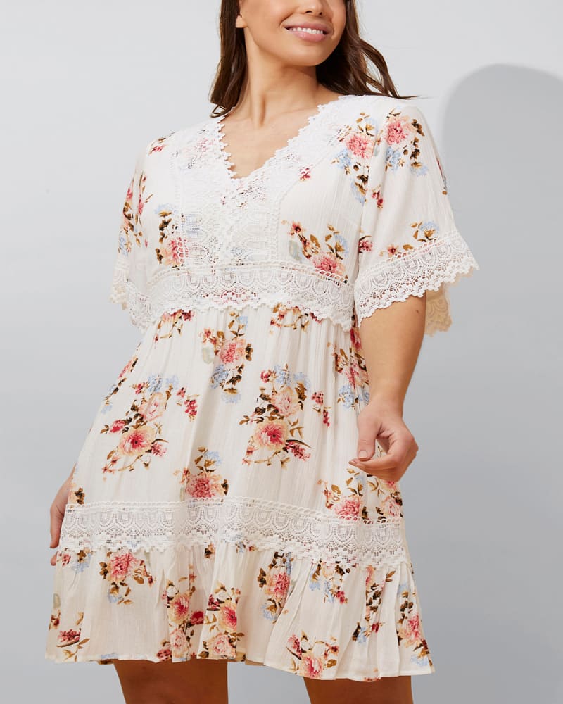 Front of a model wearing a size 3X Sara Short Dress Floral Print Embroidered White in White by ANNICK. | dia_product_style_image_id:353178